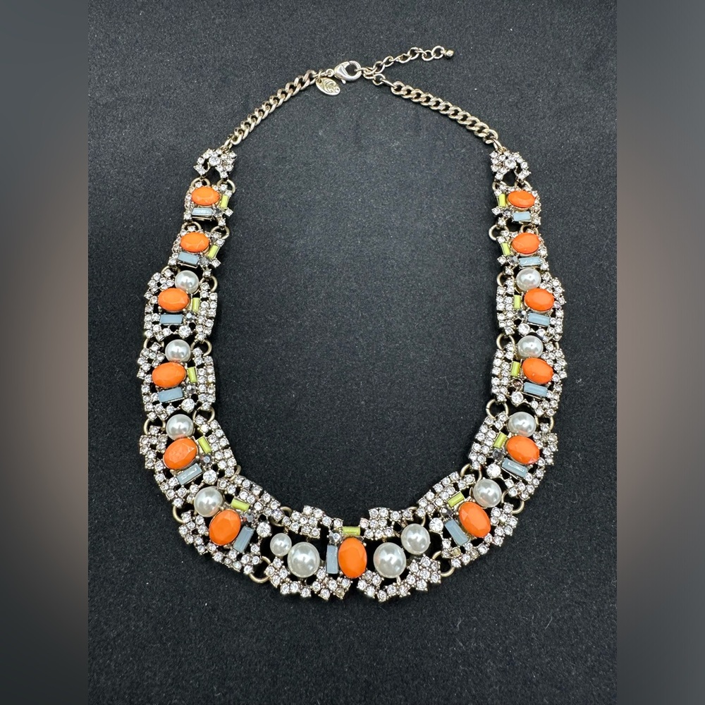 Gorgeous! Pearls, rhinestones, orange and gray accents. Adjustable to 21 in.
